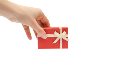 hand of young girl holding gift box. Isolated on white background. copy space, template.