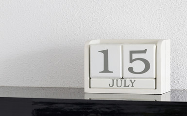 White block calendar present date 15 and month July