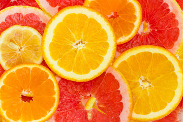 Background of the round slices of the various citrus