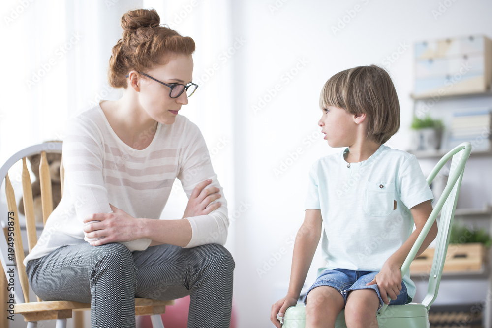 Poster Shy autistic boy and psychotherapist