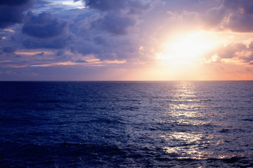 Beautiful stunning sunset at the sea, bright natural colors, background and texture