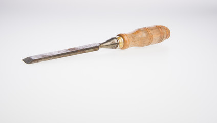 Chisel or Chisel and shavings on a background.