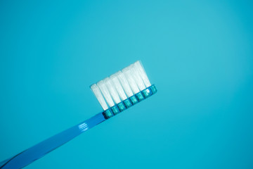Close-up of the toothbrush. 歯ブラシのクローズアップ　水色背景
