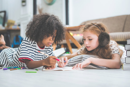 little cute girls studying and reading book at home, education concept - Powered by Adobe