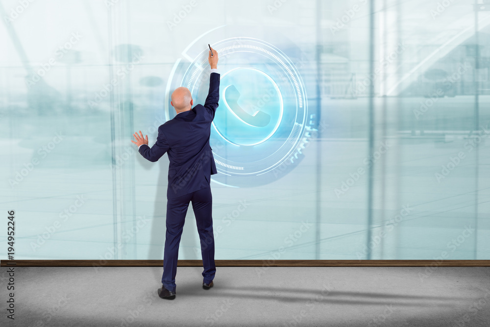 Poster businessman in front of a wall with a shinny technologic phone button - 3d render