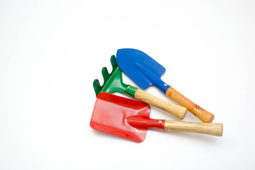 Gardening tools, spade, fork and rake  on white background