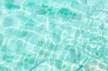 Ripple Water in swimming pool with sun reflection