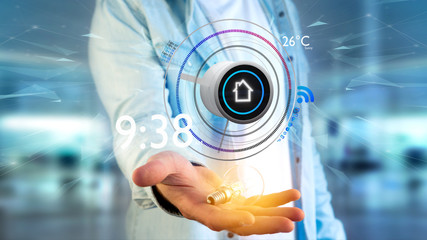 Businessman holding a Button of a smart home automation app - 3d rendering