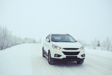 Obraz na płótnie Canvas car in a snowy landscape nature white winter snow