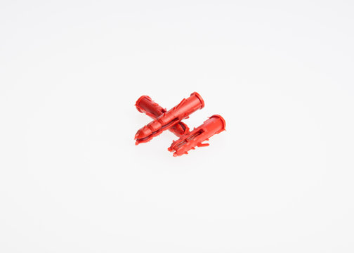 wall plugs or screw anchors on a background.