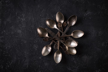 Old vintage spoons on stone table. Top view
