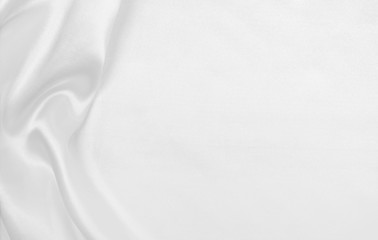 Obraz premium Smooth elegant white silk or satin luxury cloth texture as wedding background. Luxurious Christmas background or New Year background design