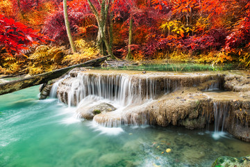 Amazing waterfall in colorful autumn forest 