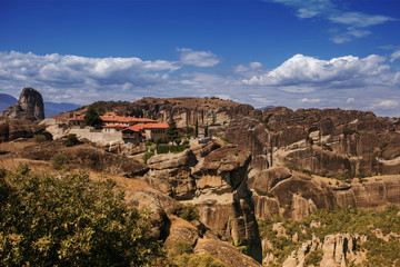 Fototapeta na wymiar Landscape of monasteries of Meteora in Greece in Thessaly at the early morning. Cliffs of Meteora opposite a morning cloudy sky background