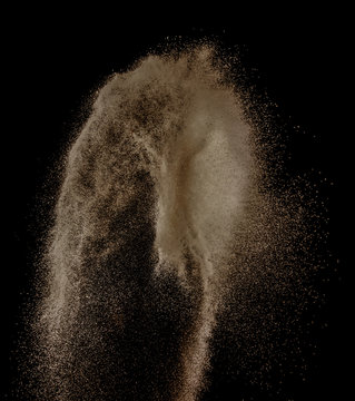 Sand explosion isolated on over dark background,Abstract sand cloud,Motion blur