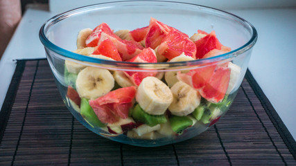 Fruit salad in transparent bowl