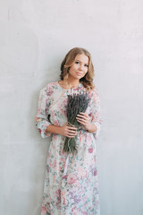 Fototapeta premium beautiful young blonde woman in nice spring dress, elegant black sunglasses posing in a studio. Fashion spring summer photo