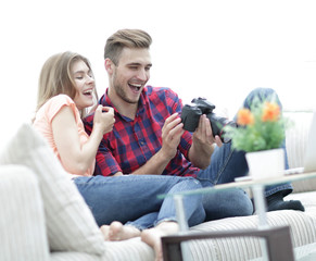 modern young couple checks the photos on the camera