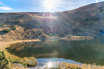 Mountains lake with reflection in blue water