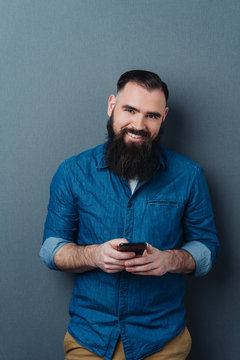 Attractive bearded man with a warm friendly smile