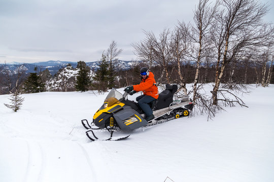 Athlete on a snowmobile