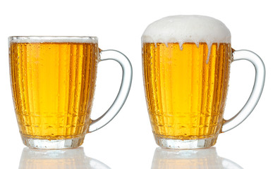 Set of mugs of cold light beer with foam isolated on white background