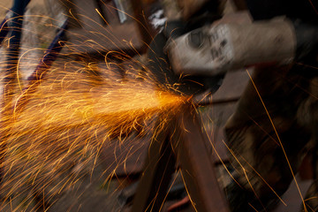 hands at work with metal welding - obrazy, fototapety, plakaty