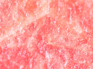 Ripe, juicy, pink, sweet, flesh of watermelon close-up. Seedless watermelon background. Macro. Cut of a red of berry, pulp texture. Citrullus lanatus, Cucurbitaceae. Kind of berry, pepo