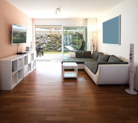 Living room with window and garden view.