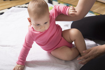 Fototapeta premium baby sitting up exercise. selective focus