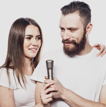 Happy Couple Singing In Karaoke