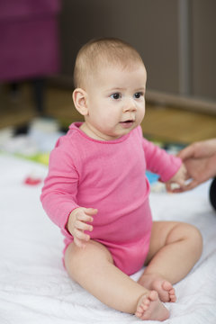 baby sitting up exercise. selective focus