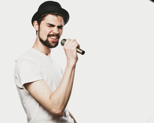 young man singing with a microphone