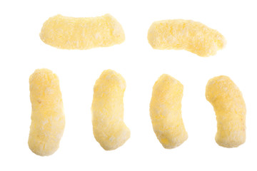 Sweet crunchy corn sticks or snacks isolated on white background. Top view. Flat lay