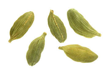 Green cardamom seeds isolated on white background. Top view. lay flat