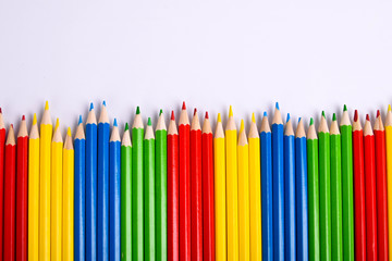  Colorful pencils pattern isolated on white background. Top view colorful of color pencils.Colored pencils, isolated on the white background. Color pencil with copy space isolated on white background,