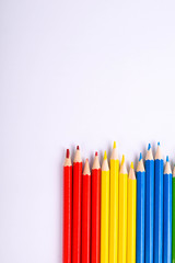  Colorful pencils pattern isolated on white background. Top view colorful of color pencils.Colored pencils, isolated on the white background. Color pencil with copy space isolated on white background,