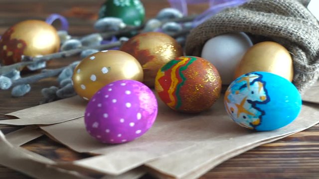Camera panning and close up of Easter decoration, traditionally painted eggs.