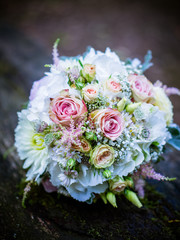 The bridal bouquet in the summer at the wedding