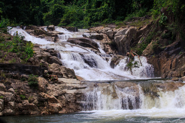 Cascade of Waterfalls in Stones against Trees