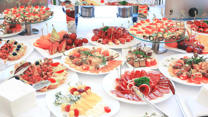 catering table set service with silverware and glass