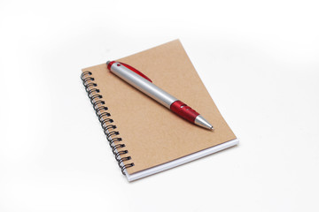 Notebook with pen isolated on white background
