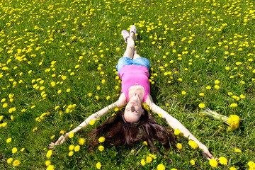 Portrait of a girl in dandelion field