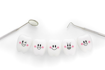 Teeth smile emotion with dental mirror and dental plaque cleaning tool isolated on white...