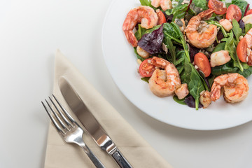 Fresh salad plate with shrimp, tomato and mixed greens. Healthy food. Clean eating.