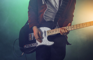 Teenagers are playing rock.