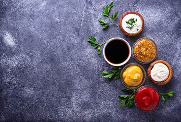 Fototapeta na wymiar Set of different sauces and spices