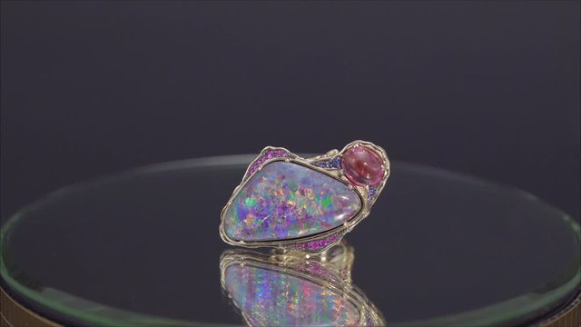 Jewelry ring on the stand. A precious ring. Ring with precious metal.