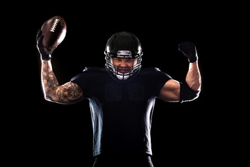 American football sportsman player isolated on black background