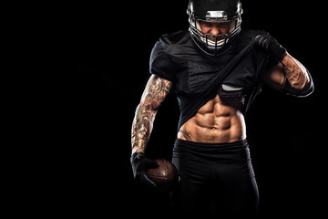 American football sportsman player isolated on black background